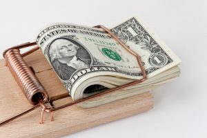 13510403 - many american dollar bills in mouse trap debt trap